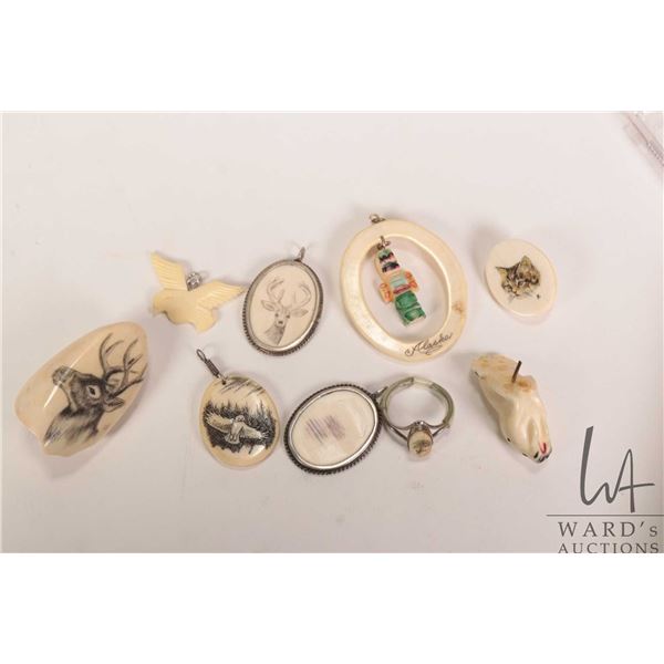 Selection of ivory and bone carvings including scrimshaw elk tooth, pendants etc. Can not be shipped