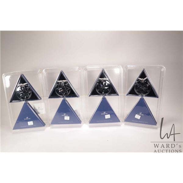 Four new in package Swarovski crystal Christmas ornaments including two 2012 and two 2013