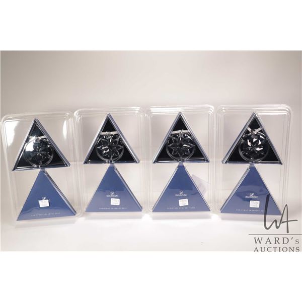 Four new in package Swarovski crystal Christmas ornaments including two 2012 and two 2013