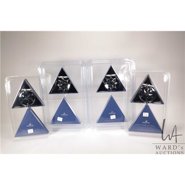 Four new in package Swarovski crystal Christmas ornaments including two 2012 and two 2013