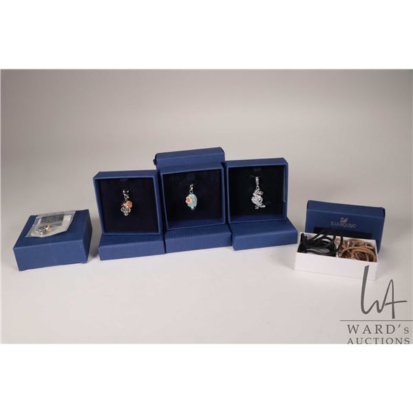 Three Swarovski hanging charms including two skulls and an Asian dragon plus a Chamilia .925 sterlin