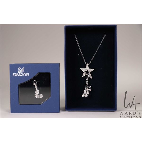 Swarovski crystal star on box chain with two hanging charms including teddy bear and a pair of   Dis