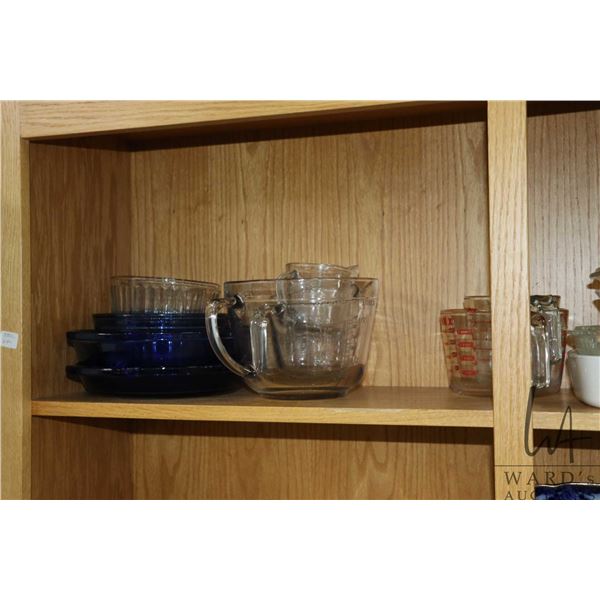 Selection of Anchor Hocking cookware including blue glass pie plate, open casserole and a serving di