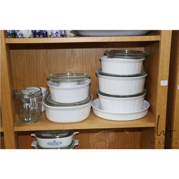 Selection of vintage cookware including Corning ware and Pyrex, five lidded casserole, pie plate and