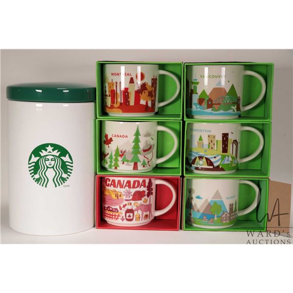 Six Starbucks coffee mugs from the "You Are Here" collection including Vancouver, Montreal, Edmonton