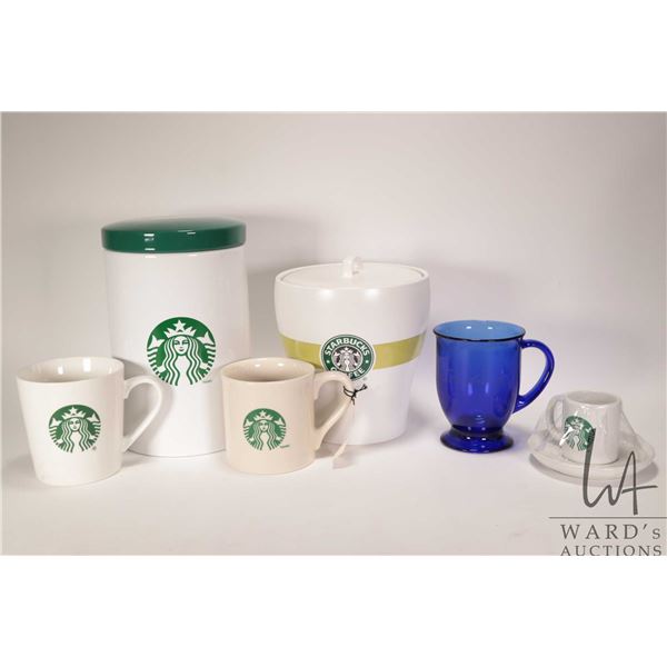 Selection of six Starbucks collectibles including mugs, espresso cup with saucer and two lidded cani
