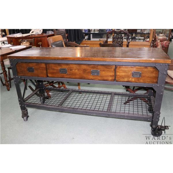 Modern three drawer Industrial style island on castors, 37" H X 72" W X 24" D. Shelf to bottom of dr