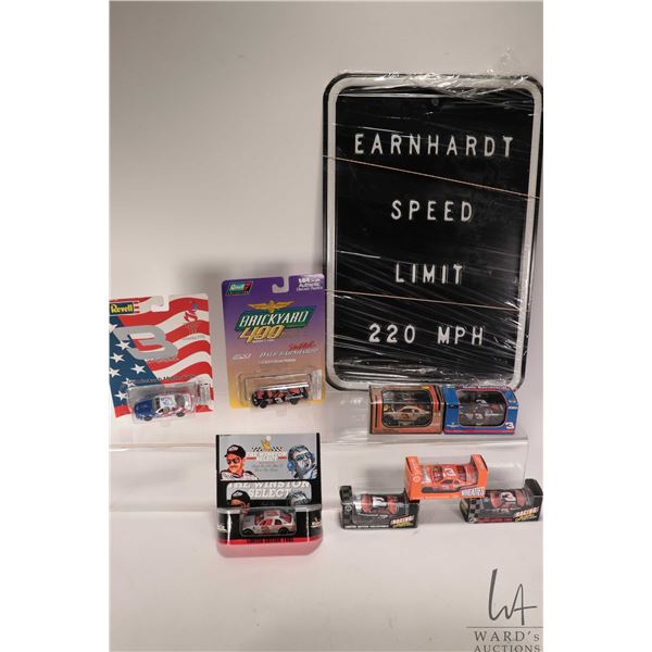 Eight 1:64 scale collectible Dale Earnhardt collectible die cast cars and a metal Earnhardt Speed Li