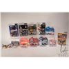 Image 1 : Twelve 1:64 scale collectible die cast race cars including Casey Mears, Kerry Earnhardt, Steve Pack,