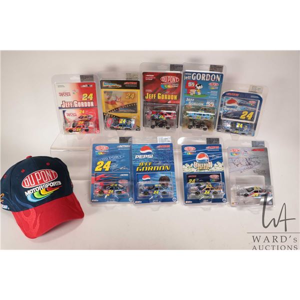 Nine 1: 64 scale die cast collectible Jeff Gordon race cars 2000-2004 and a Du Pont Motorsport ball 