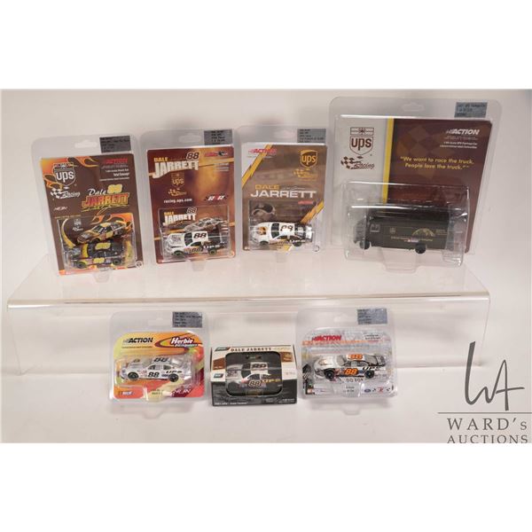 Seven 1: 64 scale die cast collectible cars including six Dale Jarrett 2001-2005 race cars and a UPS