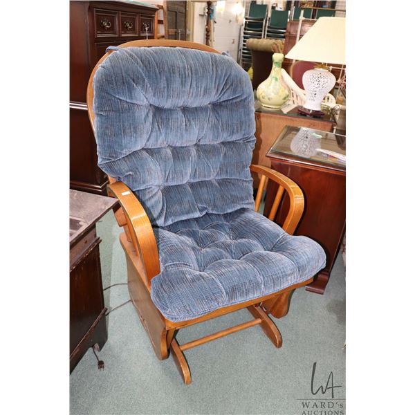 Semi contemporary oak framed glider rocker with button tufted upholstered seat and back cushions