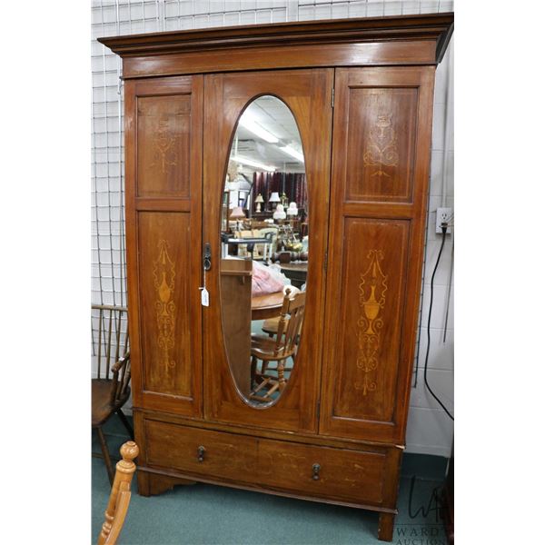 Antique Sheraton single mirrored door wardrobe with inlaid banding and panels on drawere base, note: