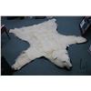 Image 1 : Polar bear rug on black wool backer, 83" tail to nose, left front paw 8" across and 5" claw to claw