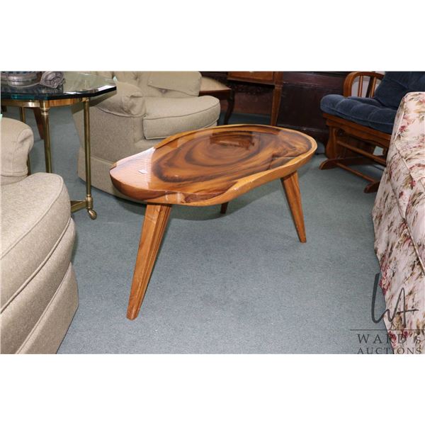 Mid century style live edge coffee table on three tapered leg, 17" H X 37" X 18"