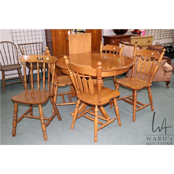 40" diameter center pedestal maple dinette table with one 15" skirted leaf and four arrow back chair