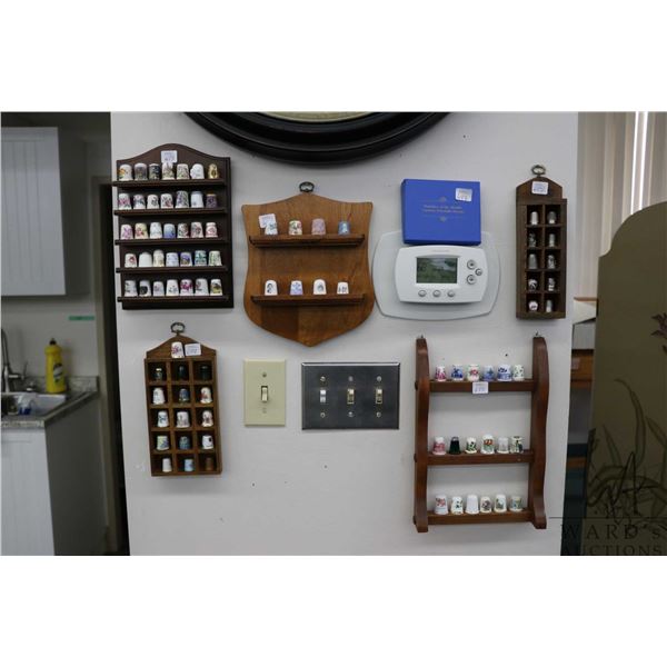 Large selection of collectible thimbles including "Thimbles of the World's Greatest Porcelain Houses