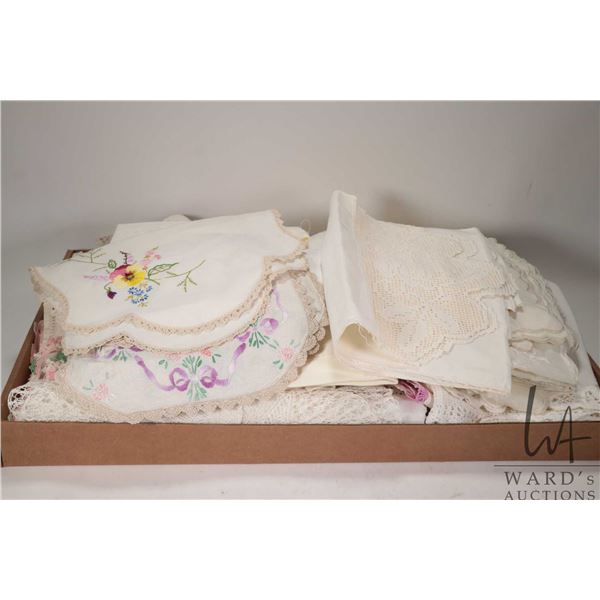 Large selection of embroidered and table linens, tray cloths, doilies etc.