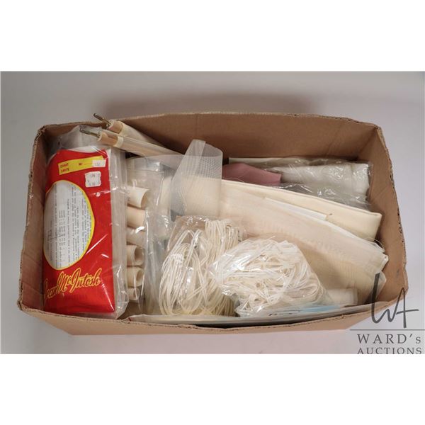 Box containing a selection of embroidery gauze and Aida and linen cloth plus battenburg lace etc.