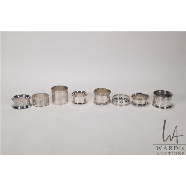 Eight vintage and antique silver napkin rings including five sterling, some with British hallmarks a