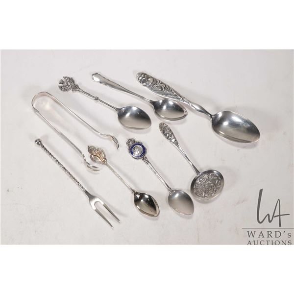 Seven vintage sterling silver spoons and a set of sterling sugar tongs