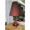 Image 1 : Mid Century Modern table lamp, possibly by Maurice Chalvignac, with tri-pod legs and red and black l