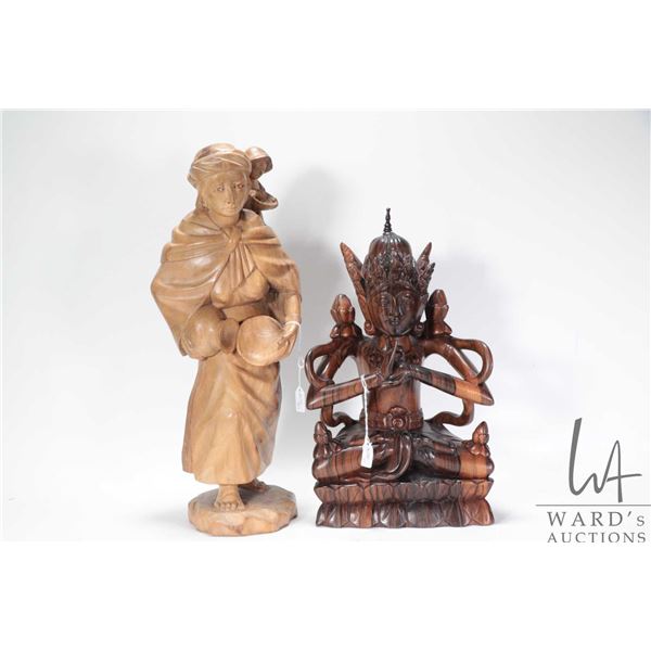 Two treenware hand carved figures including woman with child16" in height and a Balinese multi arm d
