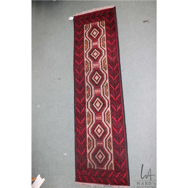 Wool carpet runner with red background, geometric design and highlights of black and taupe, 20" X 72