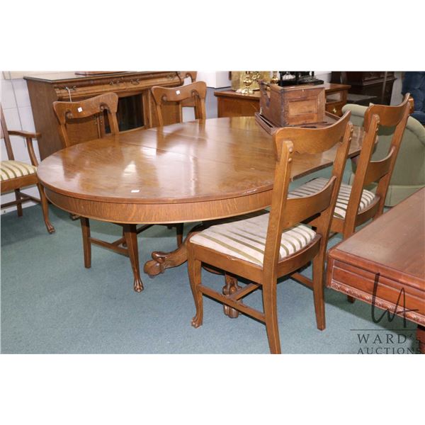 48" diameter antique Canadiana quarter cut oak dining table with heavy carved paw feet and two 12" i