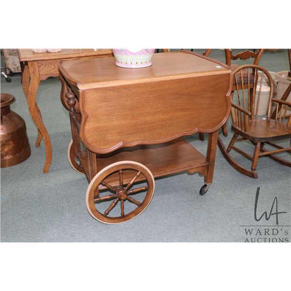 Mid 20th century drop leaf tea wagon with fold down handle and single drawer, 29" in height