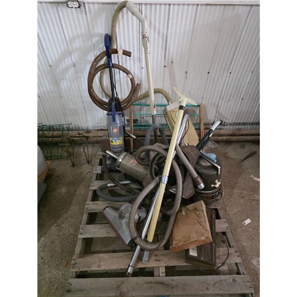 Pallet of vintage vacuums and parts