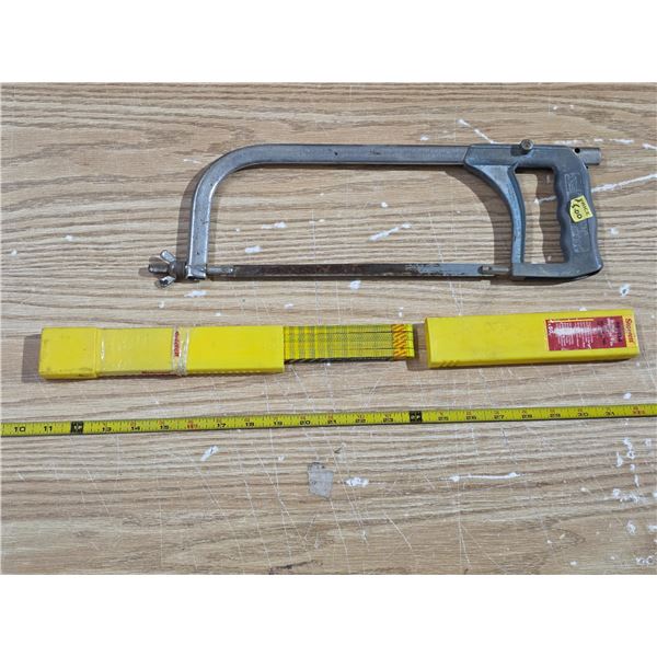 Hacksaw with extra blades
