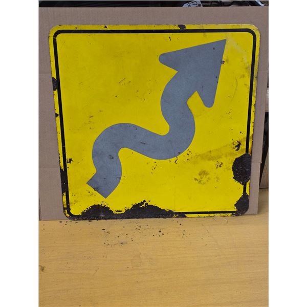 Winding road highway sign