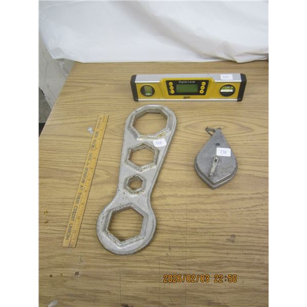 Digital Level , Big Wrench, and a String Line