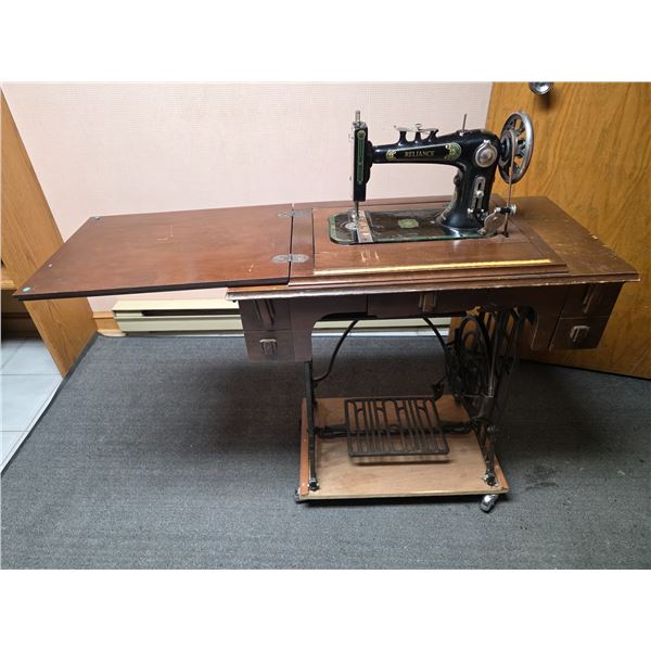 Antique Reliance sewing machine with treadle- 32" by 16" by 29"H