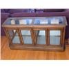 Image 1 : Solid wood and beveled glass lighted display cabinet- 56" by 16" by 30"H- has mirrored back, lights
