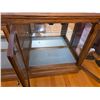 Image 2 : Solid wood and beveled glass lighted display cabinet- 56" by 16" by 30"H- has mirrored back, lights