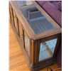 Image 4 : Solid wood and beveled glass lighted display cabinet- 56" by 16" by 30"H- has mirrored back, lights