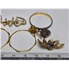 Image 2 : Gold colored brooches and bracelets