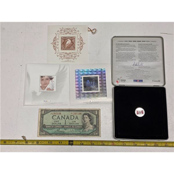 1999-2000 millennium keepsake coin and stamps- and canadian 1 dollar bill- 1954