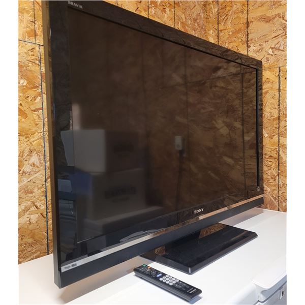 SONY BRAVIA TV with controller 28 1/4" x 44" WORKING - on a stand