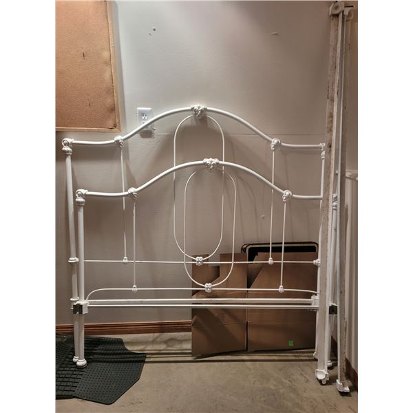 54" metal bedframe with head and footboard - repainted white @ automotive shop