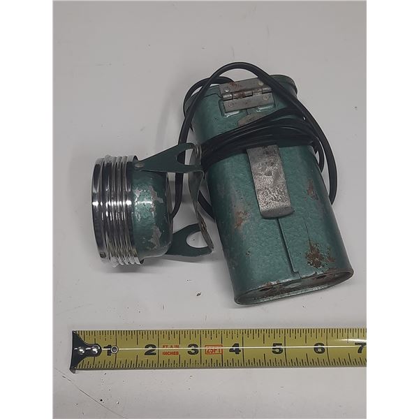 Vintage battery encased clip on belt holder with attached hard hat lamp
