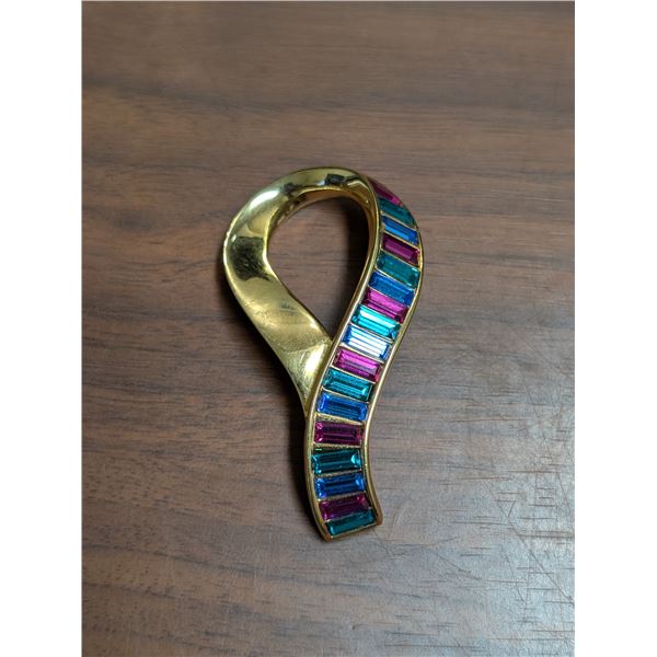 Stamped Swarovski . Figural Ribbon multi color baguette rhinestone brooch