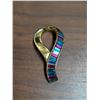 Image 1 : Stamped Swarovski . Figural Ribbon multi color baguette rhinestone brooch
