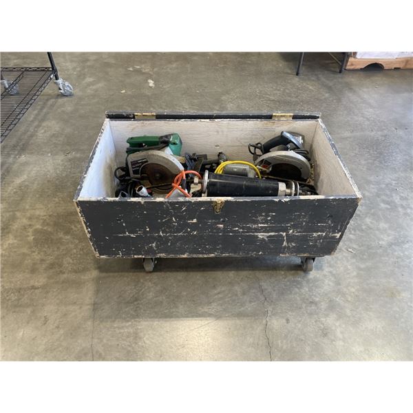 WOOD TRUNK FILLED WITH POWER TOOLS AND TRAILER HITCHES