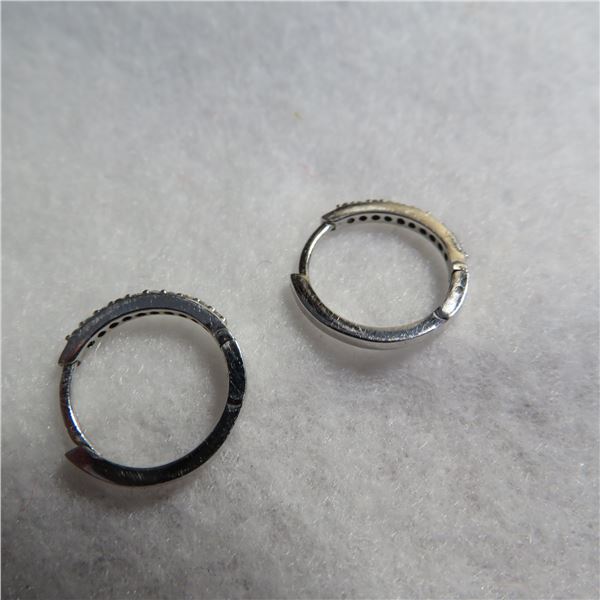 10K White gold hoop earrings with clear stones.  Beautiful earrings that clip closed!  Marked 10K