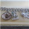 Image 3 : STERLING Vintage charm bracelet with 11 charms.  Beautiful!  Marked Sterling