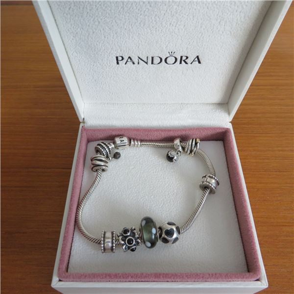 PANDORA bracelet with 9 charms in Pandora box.  Marked 925