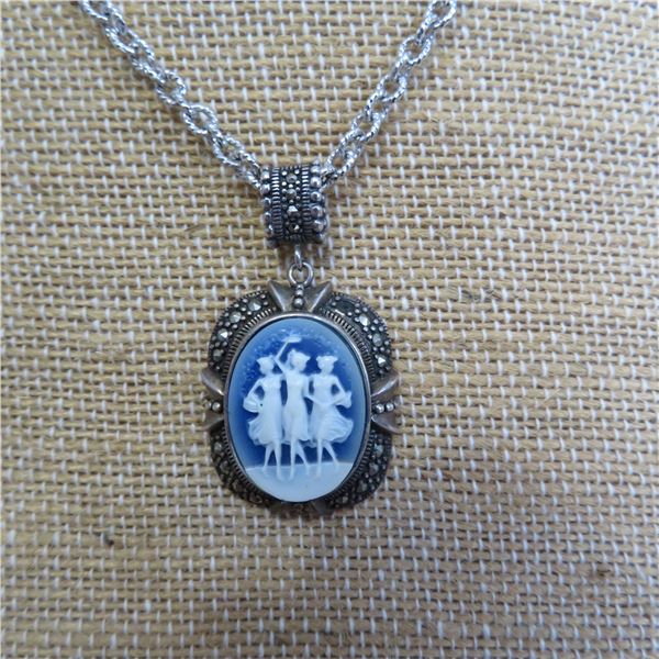 925 Silver 18" chain and 925 dancing ladies cameo pendant.  Really cool!  Marked 925
